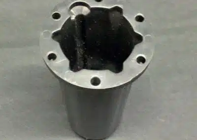 a black cylinder with a hole in it