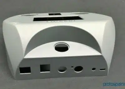 a white rectangular object with holes