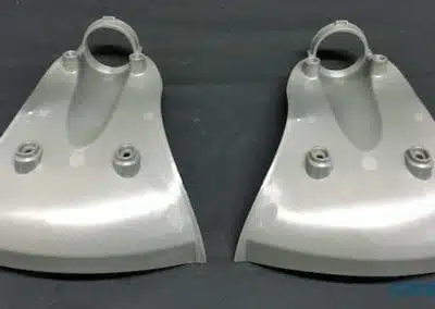 a pair of grey plastic parts
