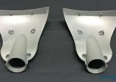a pair of grey plastic parts
