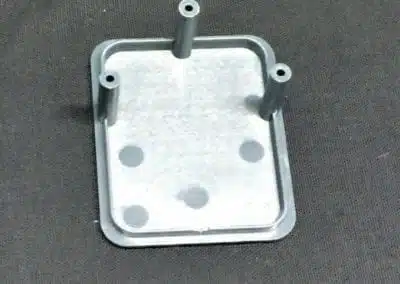 a metal plate with holes