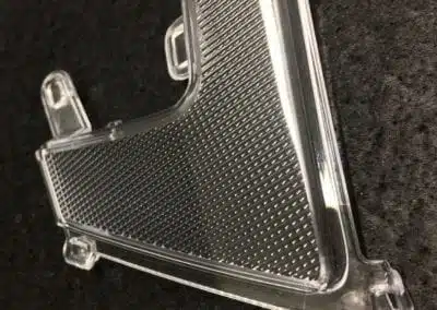 a clear plastic object with holes
