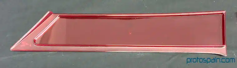 molde-serie–automocion-pc-filtro-3-1 a red rectangular object on a black surface