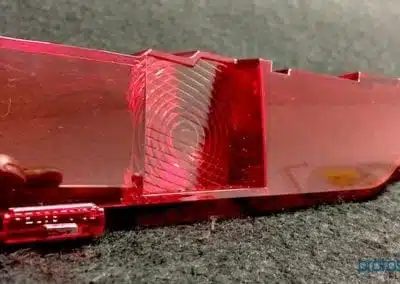 a red rectangular object with a hole