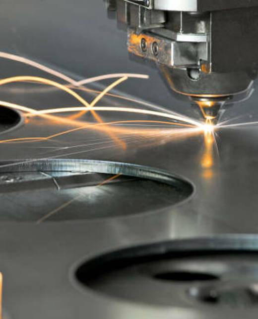 Laser metal cutting manufacturing tool in operation.